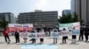 Protesters stand with banners to oppose planned joint military exercises between South Korea and the United States near the U.S. embassy in Seoul, South Korea, Monday, Aug. 5, 2019. The both countries are preparing to hold their annual joint…