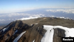 FILE - The peak of Mt. Kilimanjaro is seen from an aircraft in northeastern Tanzania,. Taken 10.31.2005