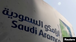 FILE - Saudi Aramco logo is pictured at the oil facility in Khurais, Saudi Arabia, Oct. 12, 2019. 