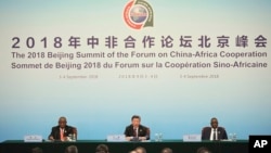 Chinese President Xi Jingping sits with South African President Cyril Ramaphosa, and Senegalese President Macky Sall, to give a joint press conference for the 2018 Beijing Summit, of The Forum On China-Africa Cooperation, Beijing, Sept. 4, 2018.