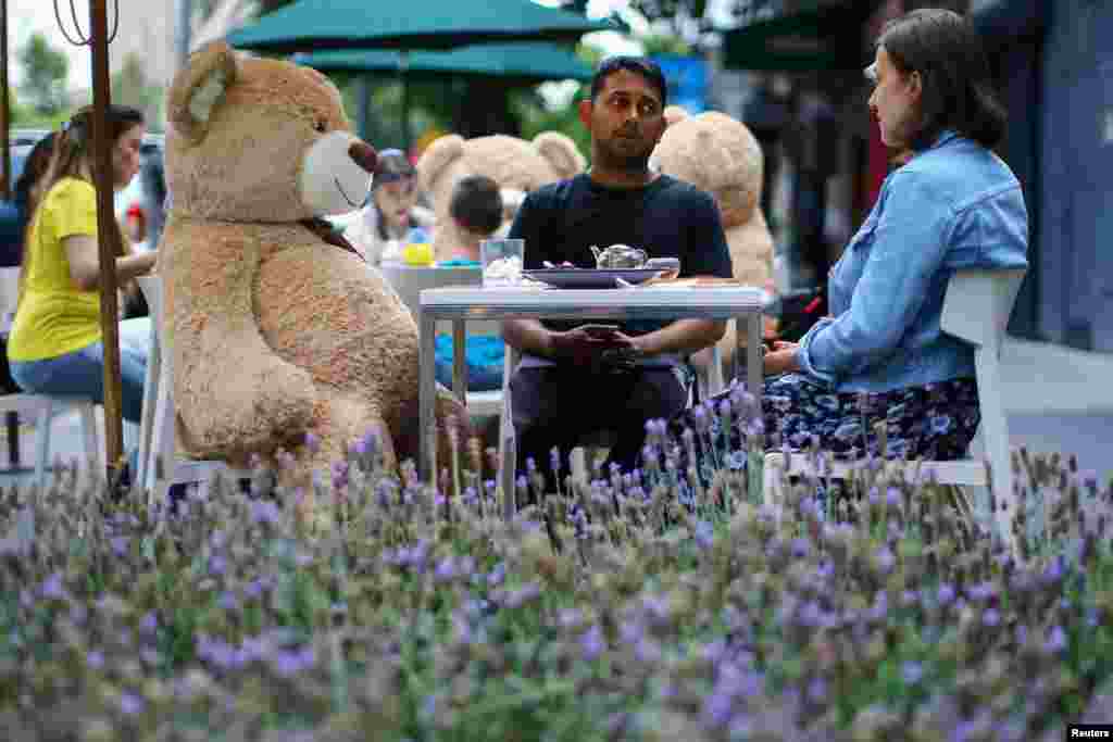 Teddy bears sit at tables to maintain social distancing measures at Jaso Bakery restaurant during the start of the gradual reopening of commercial activities as the coronavirus disease outbreak continues, in Mexico City, Mexico, July 23, 2020.