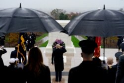 President Donald Trump participates in a wreath laying ceremony on Veterans Day at Arlington National Cemetery in Arlington, Virginia, Nov. 11, 2020.