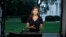 FILE - CNN White House correspondent Kaitlan Collins talks during a live shot in front of the White House, July 25, 2018.