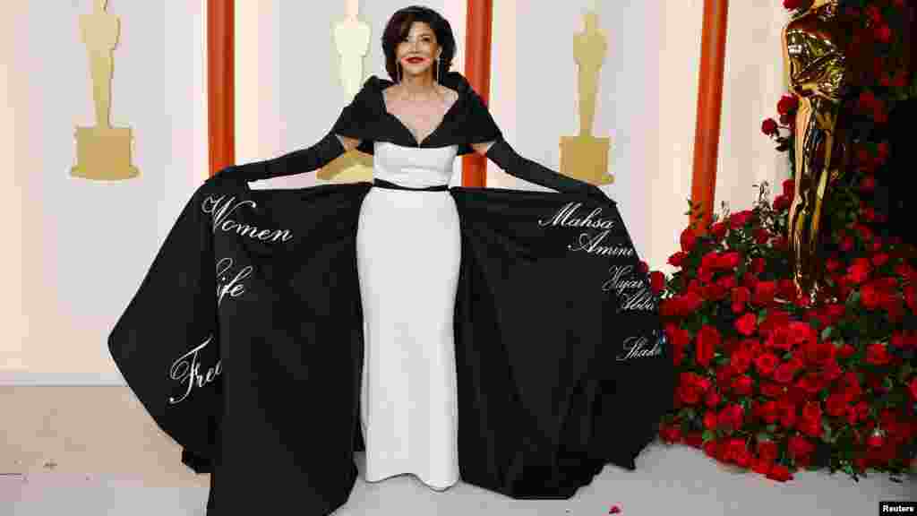 Shohreh Aghdashloo poses on the champagne-colored red carpet during the Oscars arrivals at the 95th Academy Awards in Los Angeles, March 12, 2023. (Photo by Eric Gaillard)