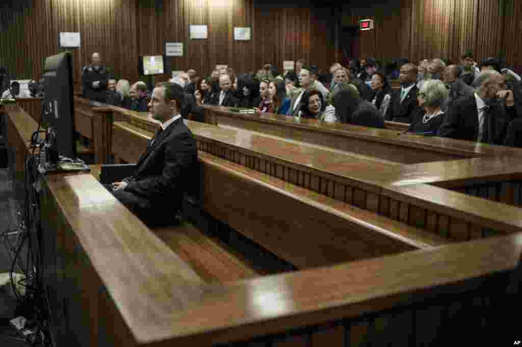 Oscar Pistorius listens to evidence in court in Pretoria, South Africa, June 30, 2014.