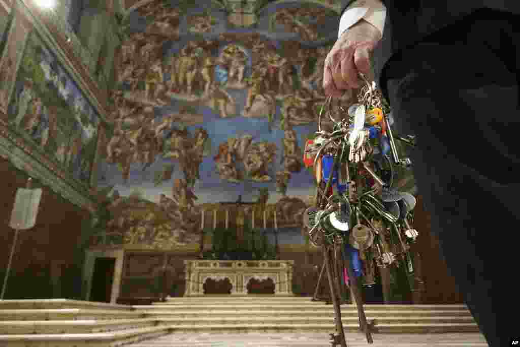 Gianni Crea, the Vatican Museums chief &quot;Clavigero&quot; keys keeper, walks through the Sistine Chapel as he prepares to open the museum, at the Vatican.