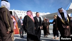 U.S. Secretary of State Mike Pompeo is welcomed by Bahraini Foreign Minister Khalid bin Ahmed Al Khalifa after arriving at Manama International Airport in Manama, Bahrain, Jan. 11, 2019. 