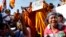 Cambodian land eviction victims and Buddhist monks shout slogans during a rally in front of the National Assembly in Phnom Penh, file photo. 