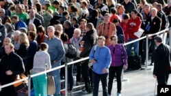 New York City Marathon: Runners line up inside the Jacob Javits Convention Center to register for the New York City Marathon, Friday, Nov. 4, 2016, in New York. The marathon is Sunday. 