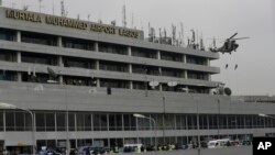 FILE - Nigerian Air Force special unit practices a counter-terrorism exercise at the Murtala Muhammed International Airport in Lagos, Nigeria.