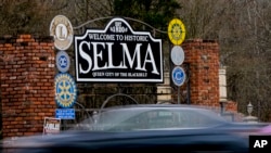 FILE - A vehicle passes by the town welcome sign, Feb. 29, 2024, in Selma, Alabama.