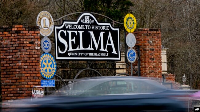 FILE - A vehicle passes by the town welcome sign, Feb. 29, 2024, in Selma, Alabama.