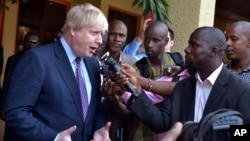 Britain's Foreign Secretary Boris Johnson speaks to media before meeting with Gambian President Adama Barrow for talks in Banjul, Gambia, Feb. 14, 2017. 