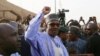 FILE - Nigerian President Muhammadu Buhari gestures as he arrives to cast a vote in Nigeria's presidential election at a polling station in Daura, Katsina State, Nigeria, Feb. 23, 2019.