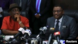 Nigeria's Minister of Health Onyebuchi Chukwu (R) speaks at a media briefing about the Ebola outbreak in Nigeria, while Interior Minister Abba Moro looks on, at the health minister's office in Abuja, Nigeria, August 14, 2014.