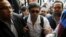 Ahmed Maher, founder of the April 6 movement, turns himself in at Abdeen court in Cairo, Nov. 30, 2013.