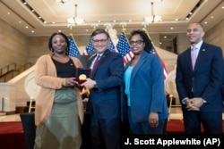 House Speaker Mike Johnson, R-La., center, presents a Congressional Gold Medal honoring NASA mathematician Mary Jackson 9//18/24