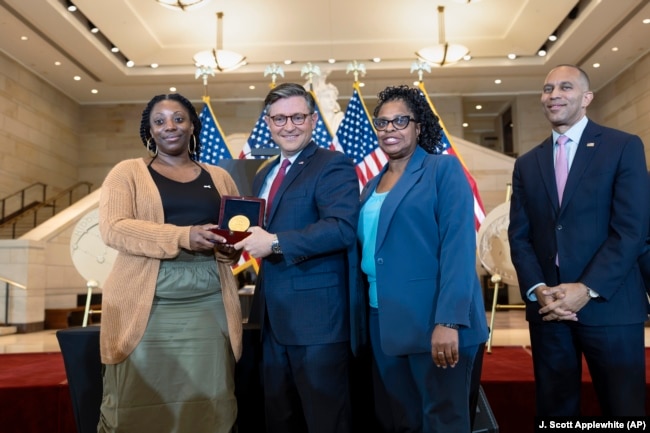 House Speaker Mike Johnson, R-La., center, presents a Congressional Gold Medal honoring NASA mathematician Mary Jackson 9//18/24