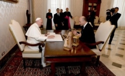 Iraq's President Barham Salih meets with Pope Francis during a ceremony, at the presidental palace in Baghdad, Iraq March 5, 2021.