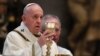 Pope Francis celebrates Easter Sunday Mass inside an empty St. Peter's Basilica, at the Vatican, April 12, 2020. 