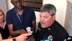 University of North Carolina-Charlotte Police Sgt. Rob Gundacker talks to reporters, May 1, 2019, in Charlotte, North Carolina. Authorities said Gundacker was the first officer to enter a college classroom on April 30, 2019, where two students died. 