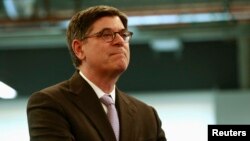 FILE - U.S. Treasury Secretary Jacob Lew listens during a tour of the AT&T Foundry in Palo Alto, California, Aug. 22, 2013. 