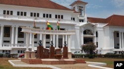 FILE - The Ghana national flag (C) flies in front of the Supreme Court building in the city of Accra, Ghana. The court has ordered the electoral commission to compile new, credible voter list for this year's elections.