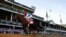 John Velazquez rides Medina Spirit across the finish line to win the 147th running of the Kentucky Derby at Churchill Downs, May 1, 2021, in Louisville, Ky. 