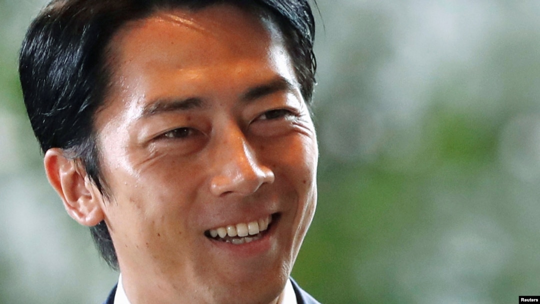 FILE - Japan's Environment Minister Shinjiro Koizumi arrives at Prime Minister Shinzo Abe's official residence in Tokyo, Japan, Sept. 11, 2019. 