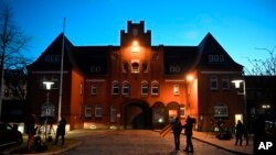 Journalists wait outside the prison in Neumuenster, Germany, April 5, 2018, after a German court ruled that former Catalan leader Carles Puigdemont can be released on bail pending a decision on his extradition to Spain.