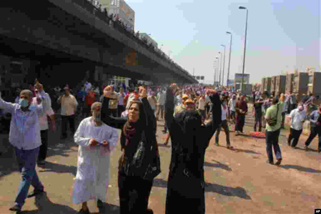 Supporters of Egypt's ousted President Mohammed Morsi chant slogans during clashes with security forces.