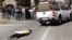 An effigy of the killer of right wing leader Eugene TerreBlanche is dragged behind a vehicle past protesters outside the court in Ventersdorp, South Africa, August 22, 2012. 