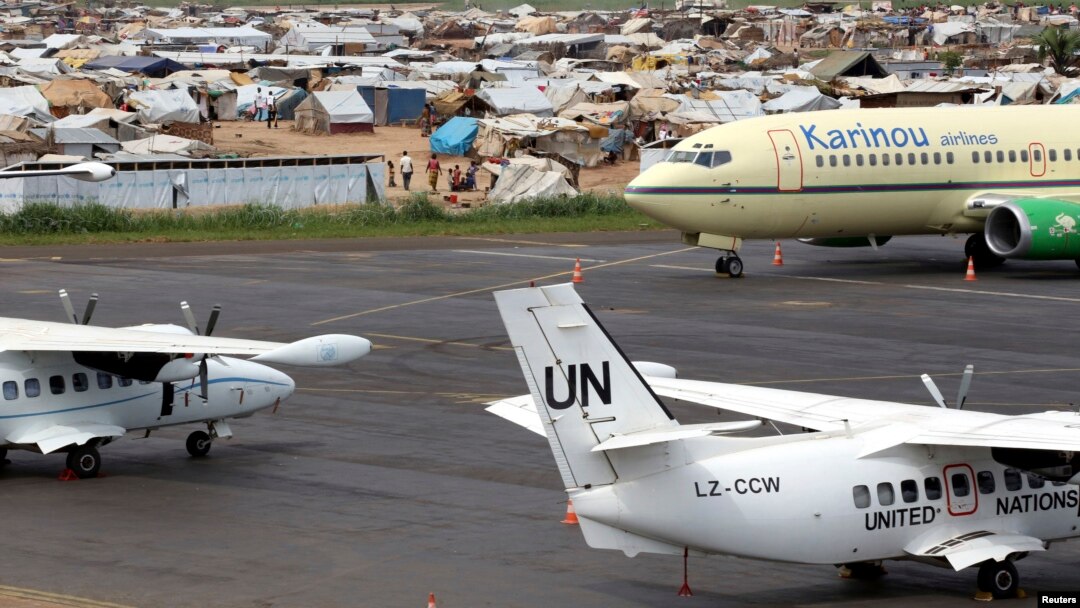 A general view shows United Nations planes in the forefront, with a camp for displaced people in the background at Mpoko airport in Bangui, Central African Republic, May 1, 2014.