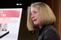 FILE - In this March 15, 2017, file photo, acting Assistant Attorney General Mary McCord speaks during a news conference at the Justice Department in Washington.