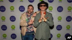 Ryan Lewis and Macklemore pose for photos at the Yahoo! On the Road Concert Series at Turner Hall, May, 12, 2013 in Milwaukee. 