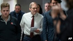 Rep. Jim Jordan of Ohio, chairman of the House Judiciary Committee and a staunch ally of former President Donald Trump, arrives as House Republicans meet behind closed doors to try to unite around him as their new nominee for speaker, at the Capitol in Washington, Oct. 16, 2023. 