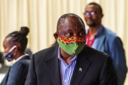 FILE - South African President Cyril Ramaphosa visits the coronavirus disease (COVID-19) treatment facilities at the NASREC Expo Centre in Johannesburg, South Africa, April 24, 2020.