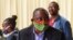 FILE - South African President Cyril Ramaphosa visits the coronavirus disease (COVID-19) treatment facilities at the NASREC Expo Centre in Johannesburg, South Africa, April 24, 2020.
