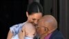 Britain&#39;s Meghan, Duchess of Sussex, holding her son Archie, meets Archbishop Desmond Tutu at the Desmond &amp; Leah Tutu Legacy Foundation in Cape Town, South Africa.