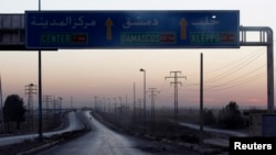 A general view shows a deserted road that leads to Deir al-Zor, Oct. 22, 2013. 