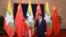 Myanmar State Counsellor Aung San Suu Kyi (L) shakes hands with Chinese President Xi (MOI)