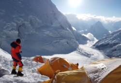 FILE - Pemba Dorjee Sherpa, 20 times Everest summiteer is seen on the camp three during the expedition of Everest, Nepal, May 20, 2019.