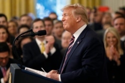 President Donald Trump pauses as he speaks in the East Room of the White House in Washington, Feb. 6, 2020.