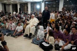 Pope Francis leaves at the end of a meeting at the Youth Centre Grha Pemuda in Jakarta, Sept. 4, 2024.