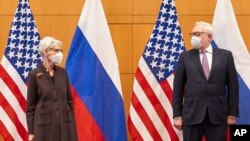 U.S. Deputy Secretary of State Wendy Sherman, left, and Russian Deputy Foreign Minister Sergey Ryabkov attend security talks at the U.S. Mission in Geneva, Jan. 10, 2022.