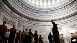 Visitors are led on an official tour, which had been suspended during the 16-day government shutdown, at the U.S. Capitol in Washington, October 17, 2013.