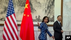 2014年9月8日美国国家安全顾问苏珊·赖斯（左）与中国国务委员杨洁篪在北京
