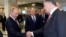 Russian President Vladimir Putin (L) shakes hands with his Ukrainian counterpart Petro Poroshenko at the start of talks in Minsk, Belarus, Aug. 26, 2014.