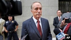 U.S. Rep. Chris Collins, R-N.Y., speaks to reporters as he leaves the courthouse after a pretrial hearing in his insider-trading case, in New York, Sept. 12, 2019.