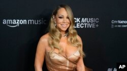 ARCHIVO - Mariah Carey aparece en la tercera ceremonia anual de Honores de la Academia de la Grabación en Los Ángeles, el 1 de febrero de 2024. 